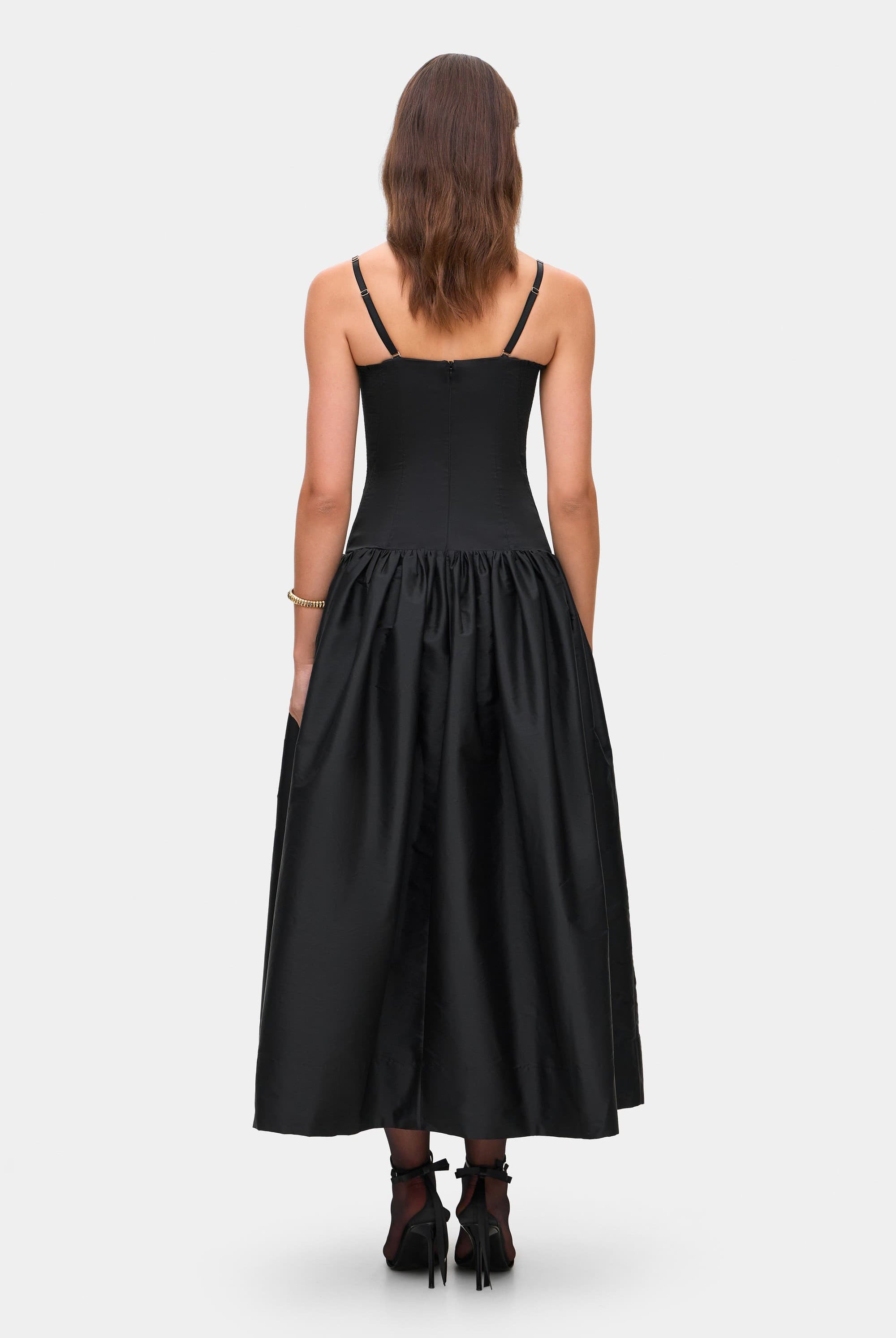 Model in Chloé midi dress with a corset top with stitching and wide skirt back view