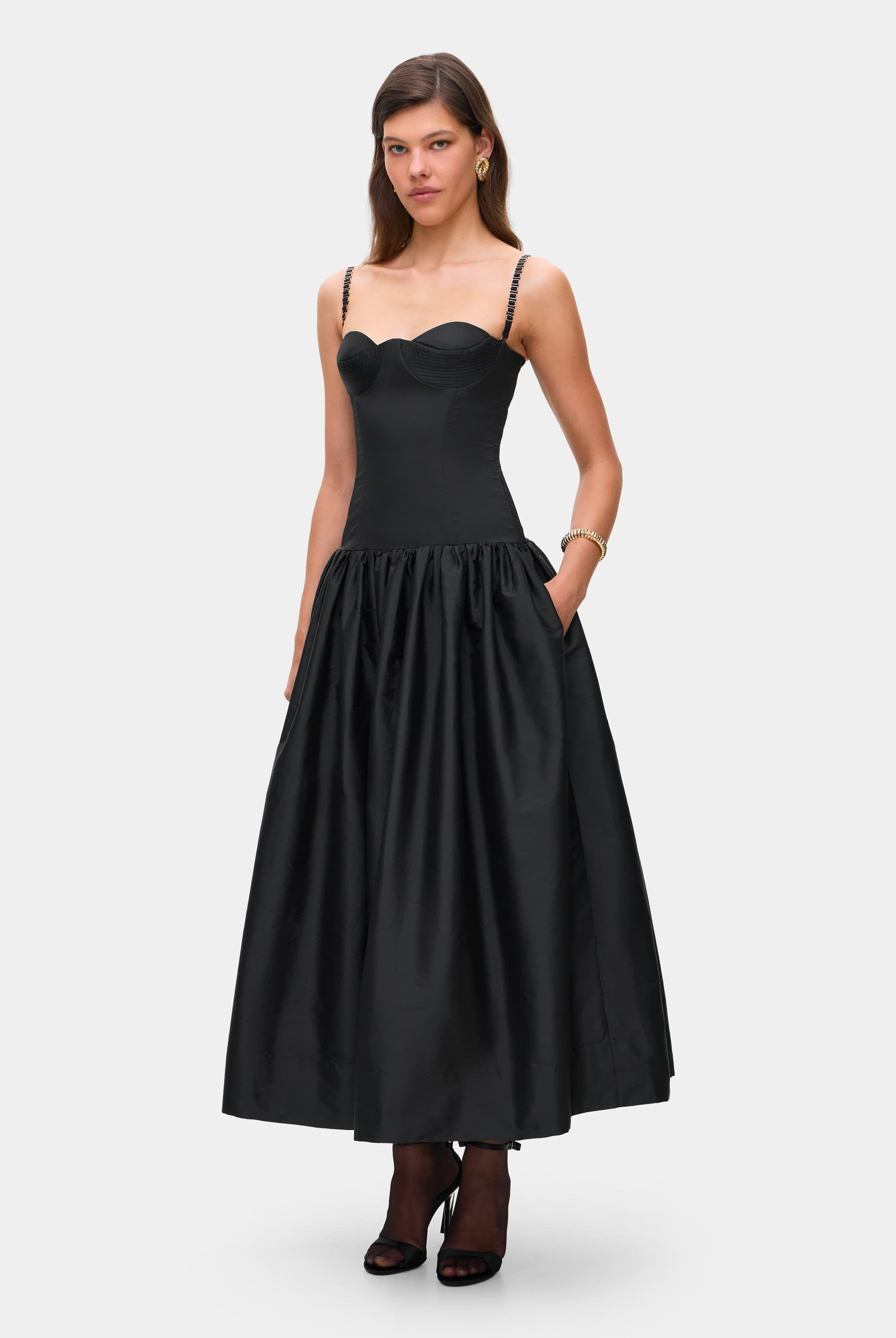 Model in Chloé midi dress with a corset top with stitching and wide skirt side view