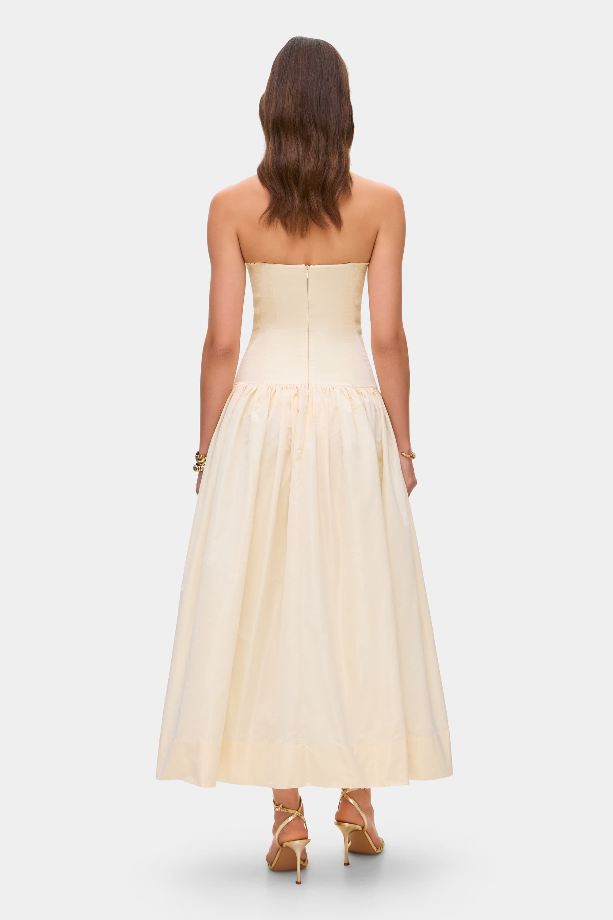 Model in Chloé midi dress with a corset top with stitching and wide skirt back view
