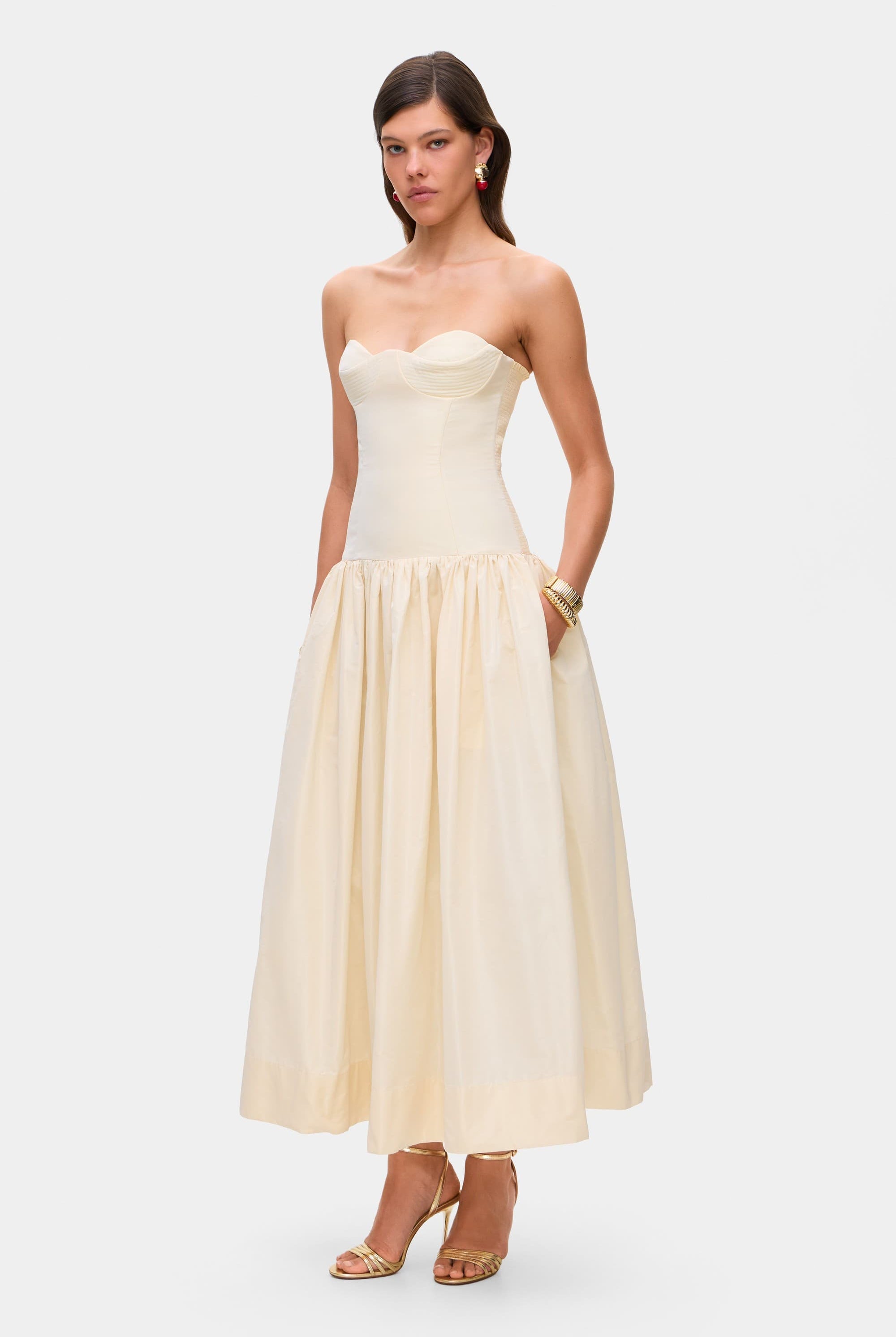 Model in Chloé midi dress with a corset top with stitching and wide skirt side view