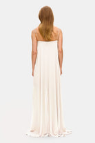 Model in Solomia maxi dress with tulip-shaped decorated cups and chiffon maxi sun skirt back view