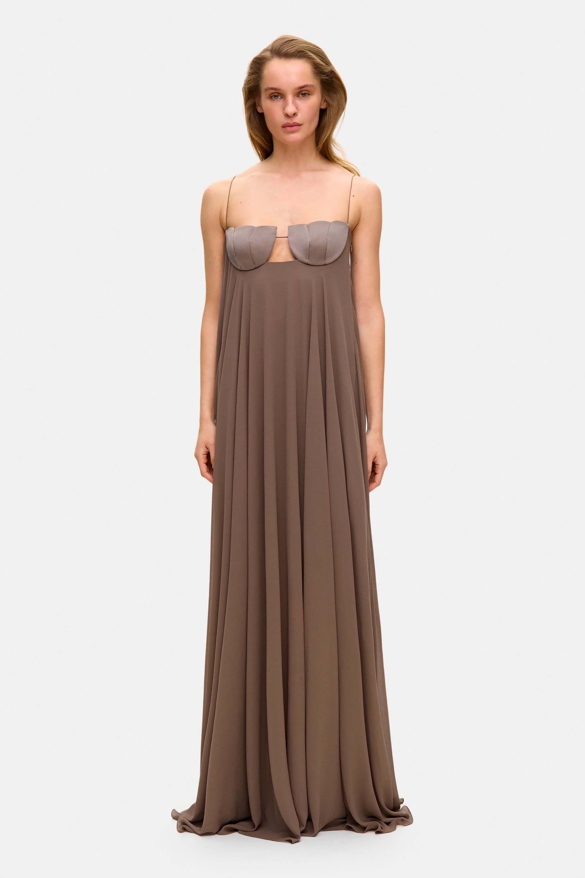 Model in Solomia maxi dress with tulip-shaped decorated cups and chiffon maxi sun skirt front view