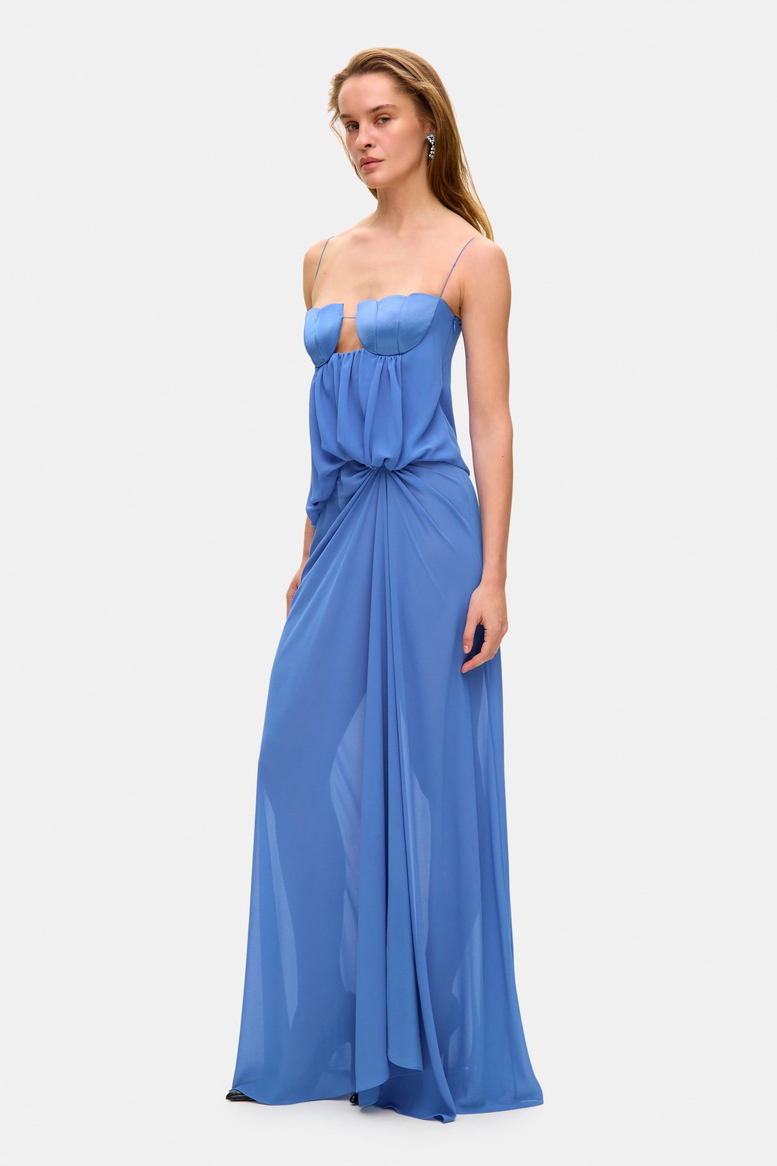 Model in loose maxi Arabella dress with tulip-shaped decorated cups and straps tied into bows side view