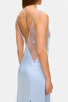Model in fitted maxi Lolita dress with decorative embroidery all over the dress side details view