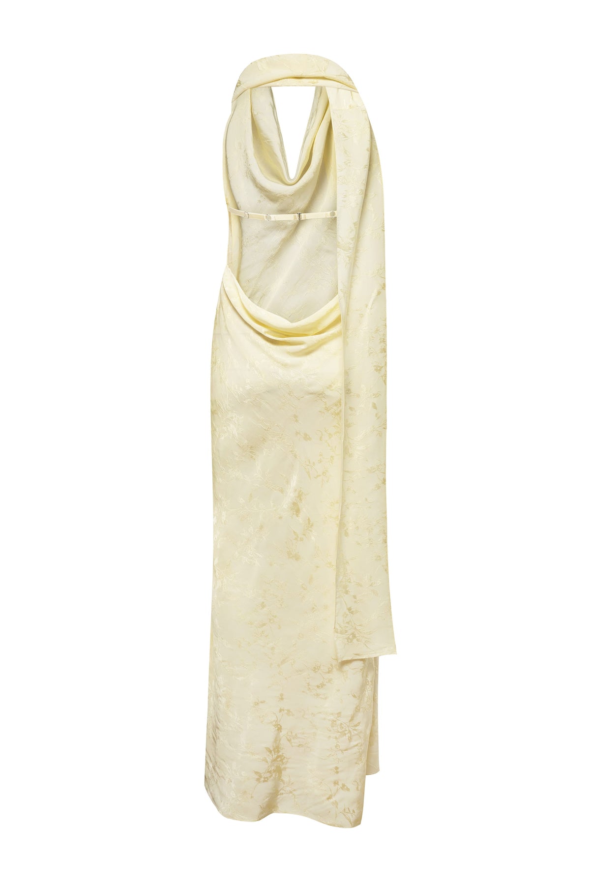 A pale yellow halter-neck maxi Kelly dress with a draped, cowl-like neckline and a subtle tonal textured pattern, shown against a plain white background, back view