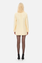 Model in Marie Antoinette mini coat back view