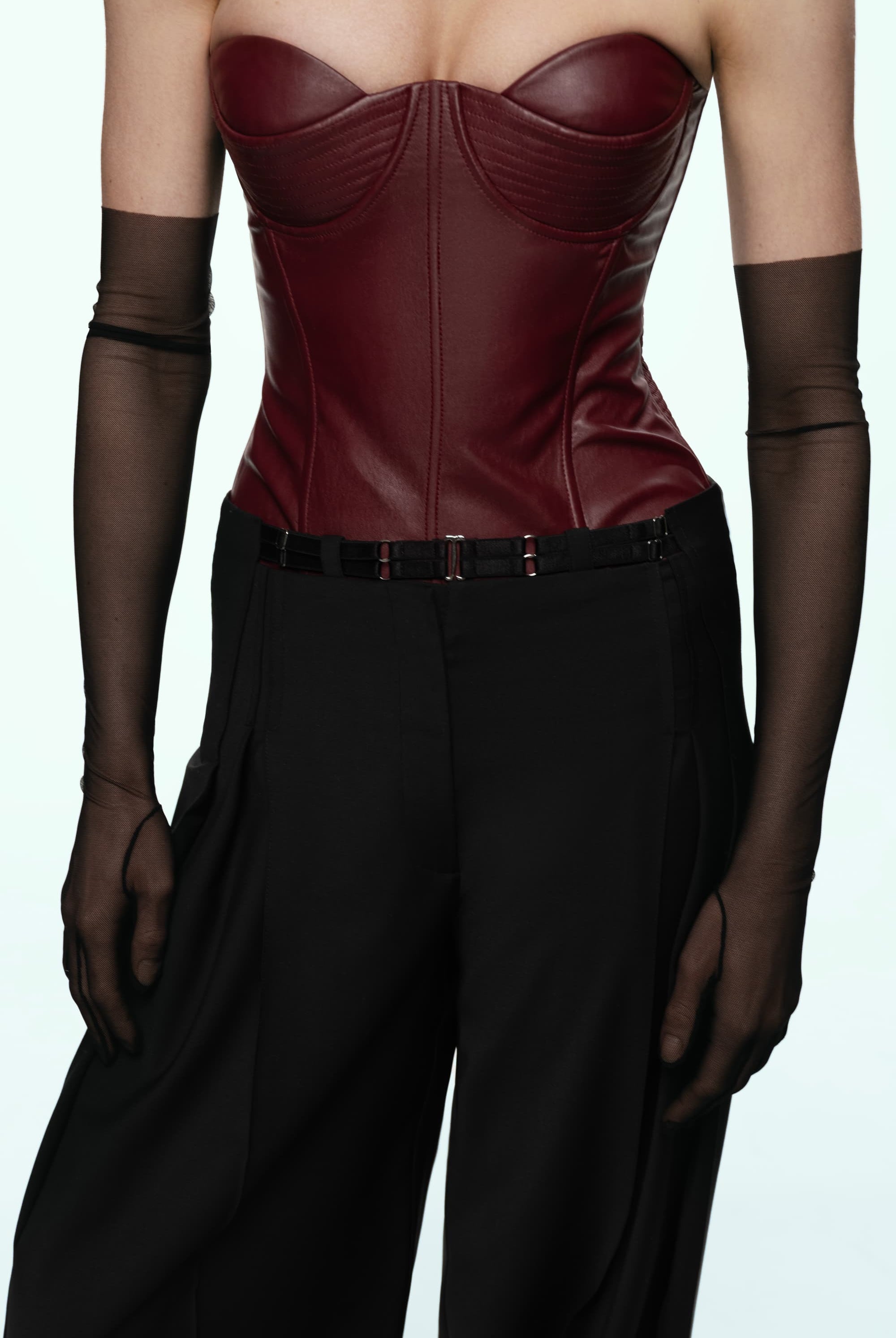 Woman wearing a black wide-leg Katherine pants on a white background, front view