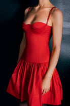 Red Chloé dress with thin straps on a dark background