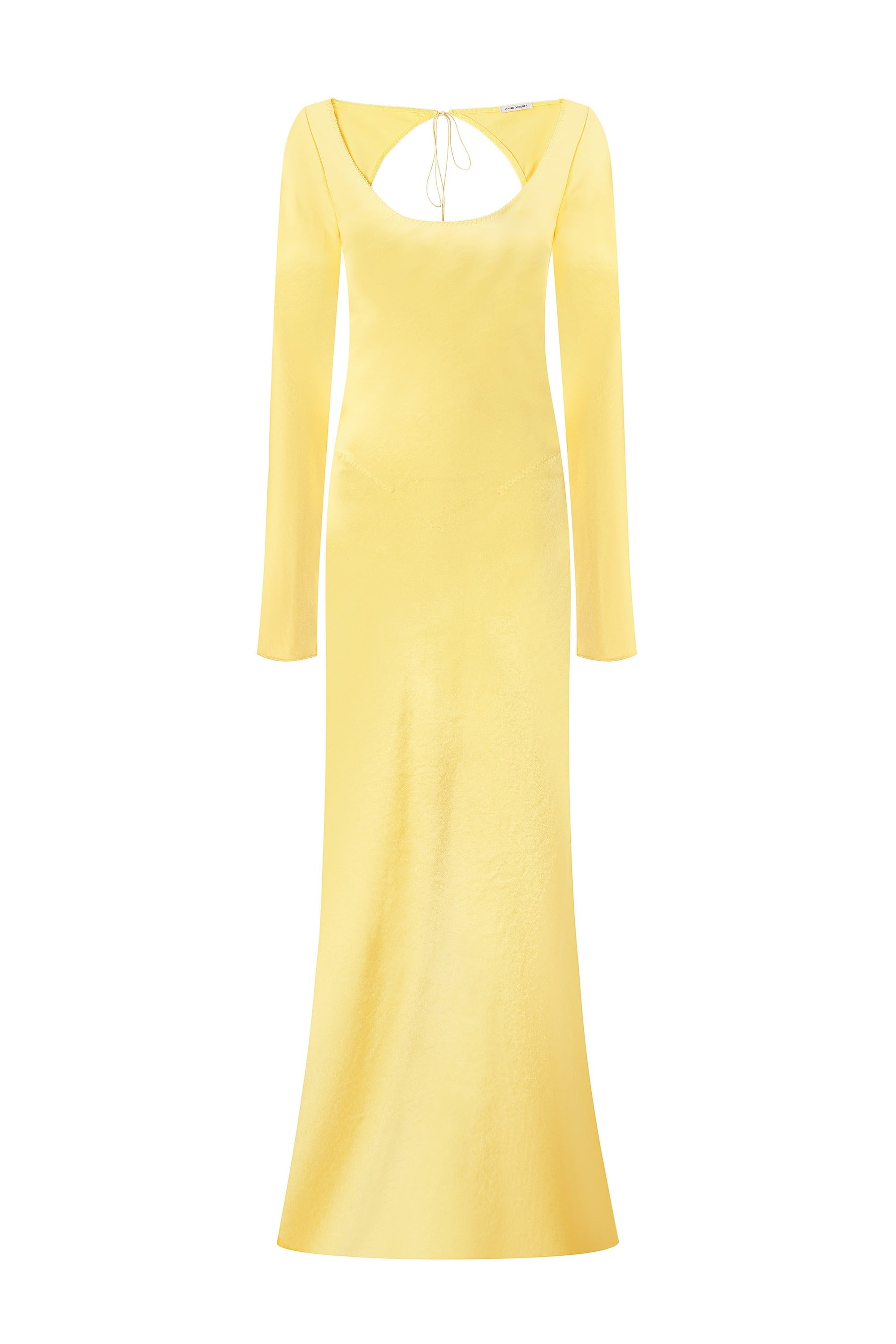 Yellow long-sleeve Margit dress with open back on a white background, front view