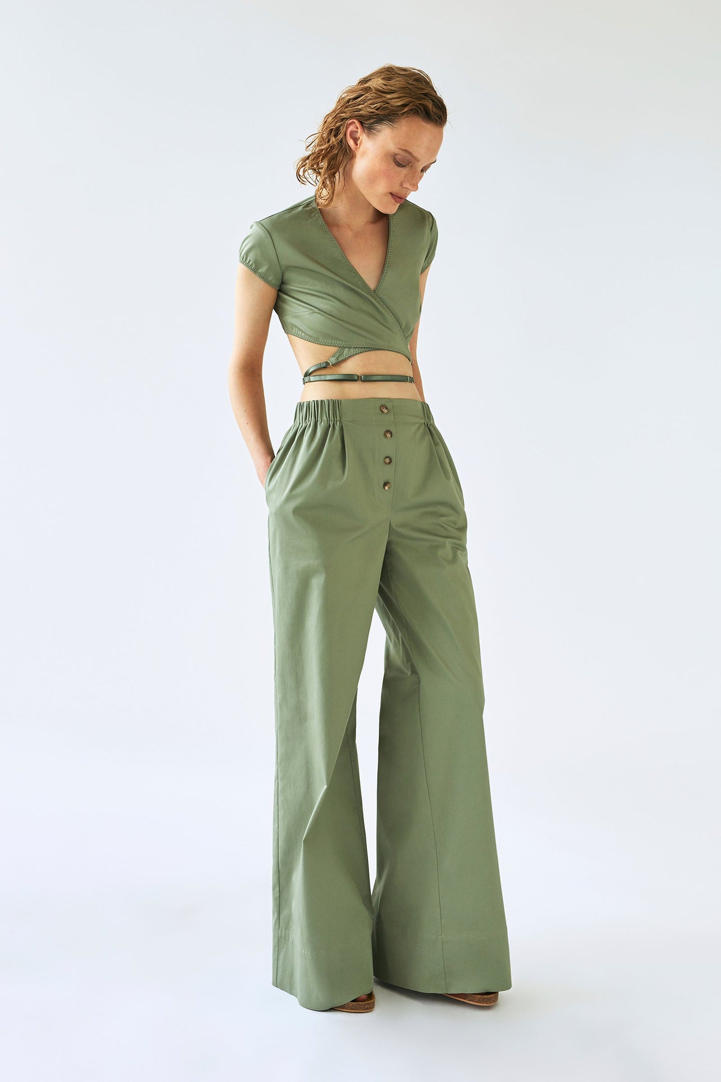 Model in olive Melba trousers