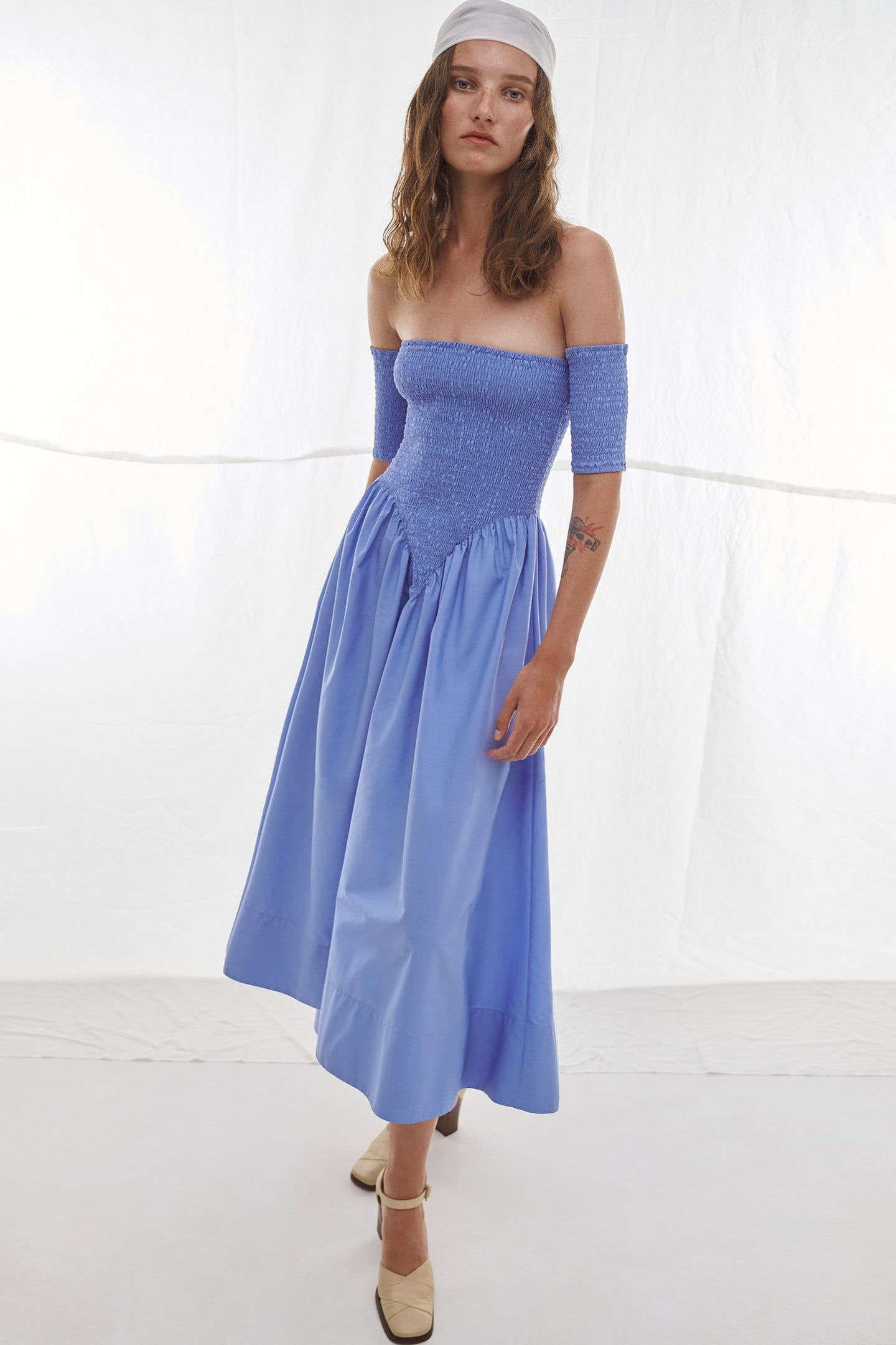 Model in blue Aphrodite dress
