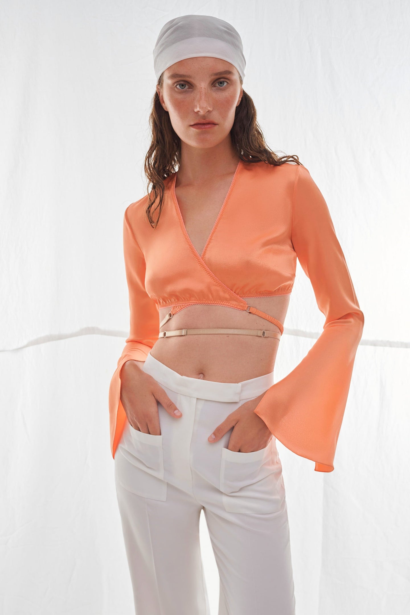 Model in orange Talia top