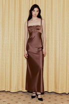 Model in brown Aglaya dress