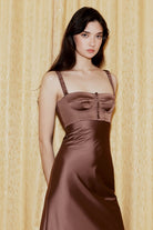 Model in brown Aglaya dress