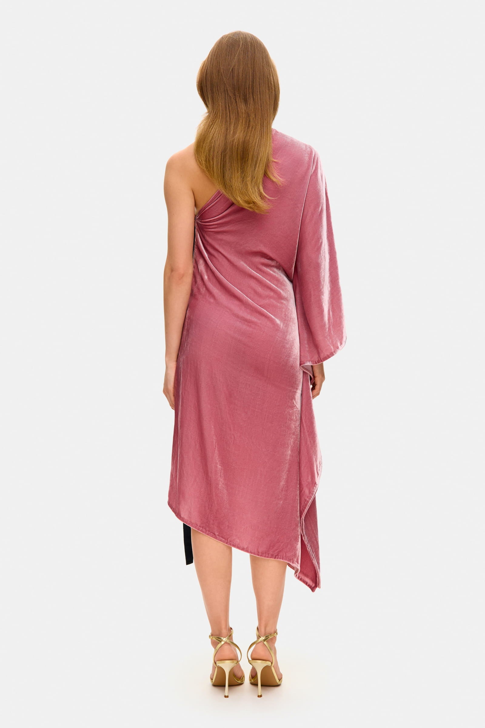 Model in one-sleeve Francesca midi dress with a decored bow on the waist back view