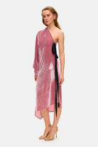 Model in one-sleeve Francesca midi dress with a decored bow on the waist side view