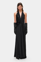 Model in open back Ruth maxi dress with decorative draping on the front, front view