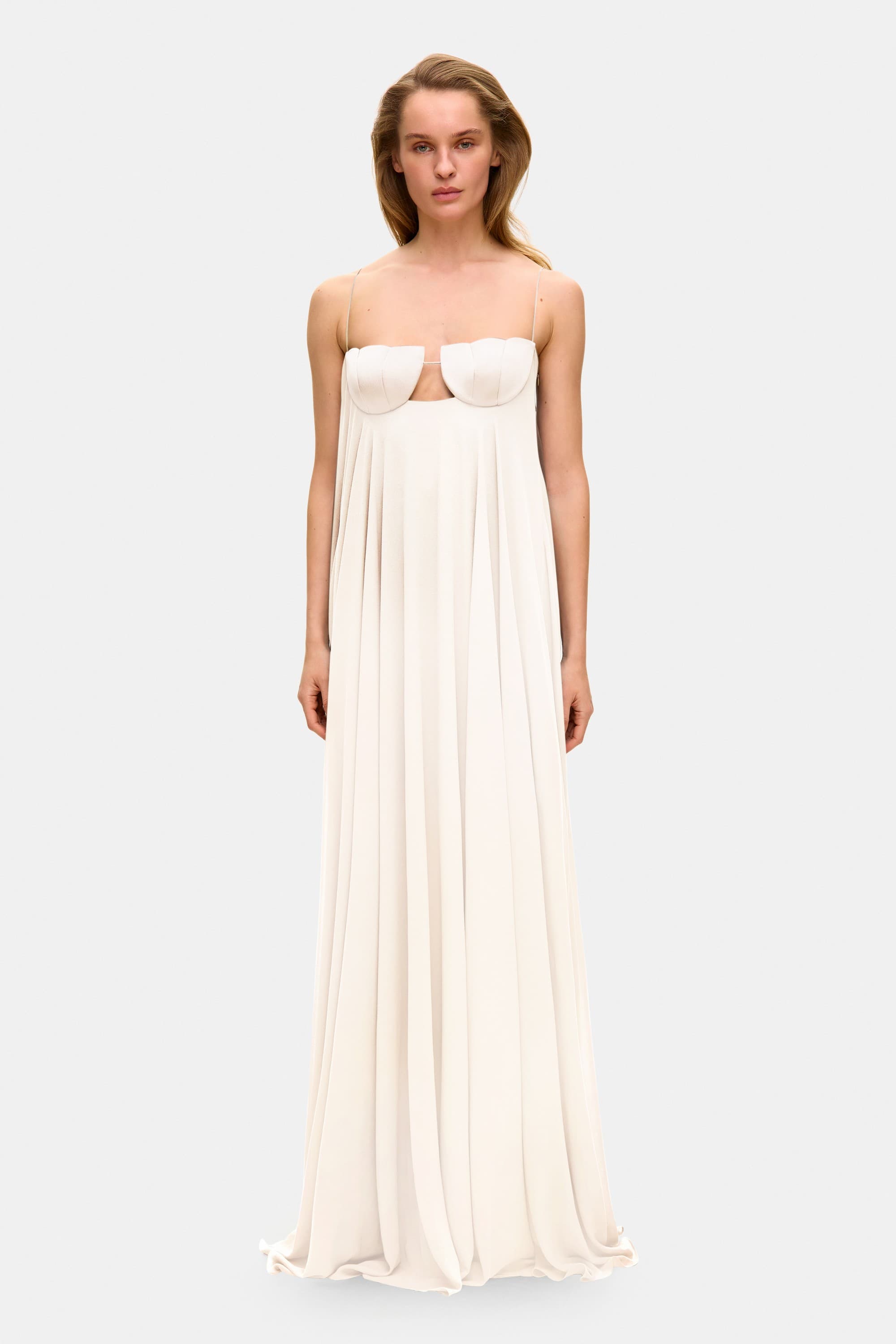 Model in Solomia maxi dress with tulip-shaped decorated cups and chiffon maxi sun skirt front view