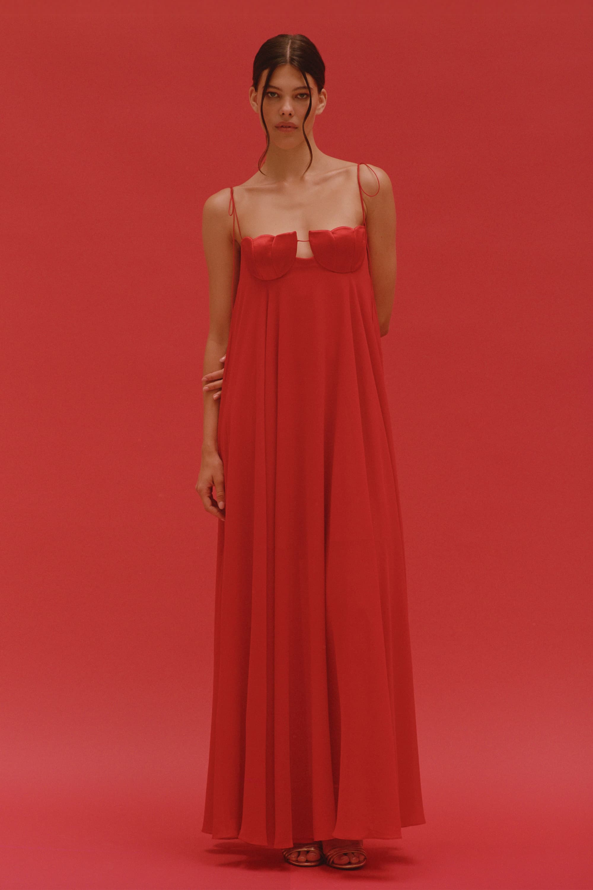 Model in Solomia maxi dress with tulip-shaped decorated cups and chiffon maxi sun skirt