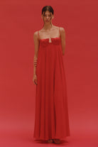 Model in Solomia maxi dress with tulip-shaped decorated cups and chiffon maxi sun skirt