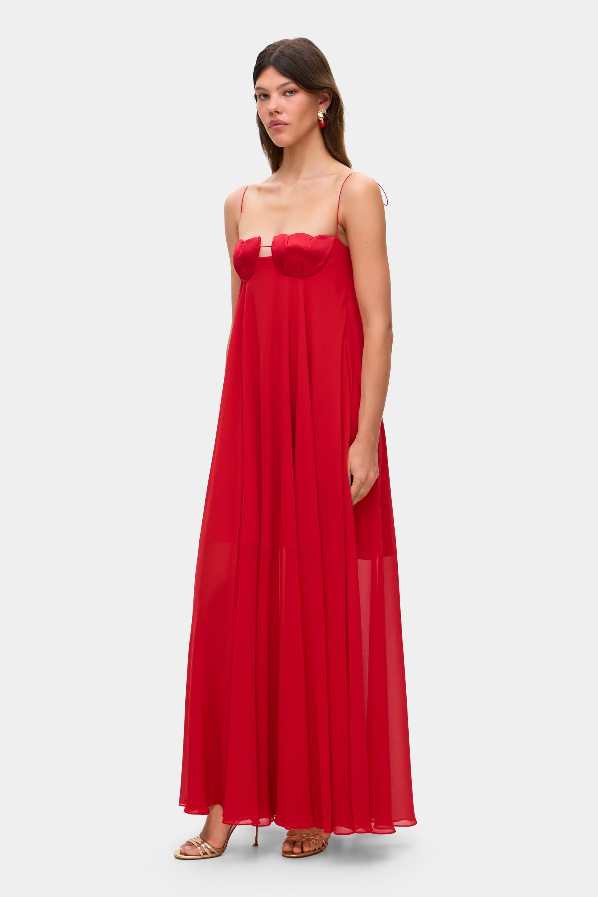 Model in Solomia maxi dress with tulip-shaped decorated cups and chiffon maxi sun skirt side view