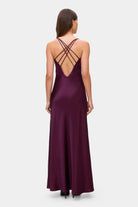Model in Melania maxi dress with decorative lines on the bodice back view