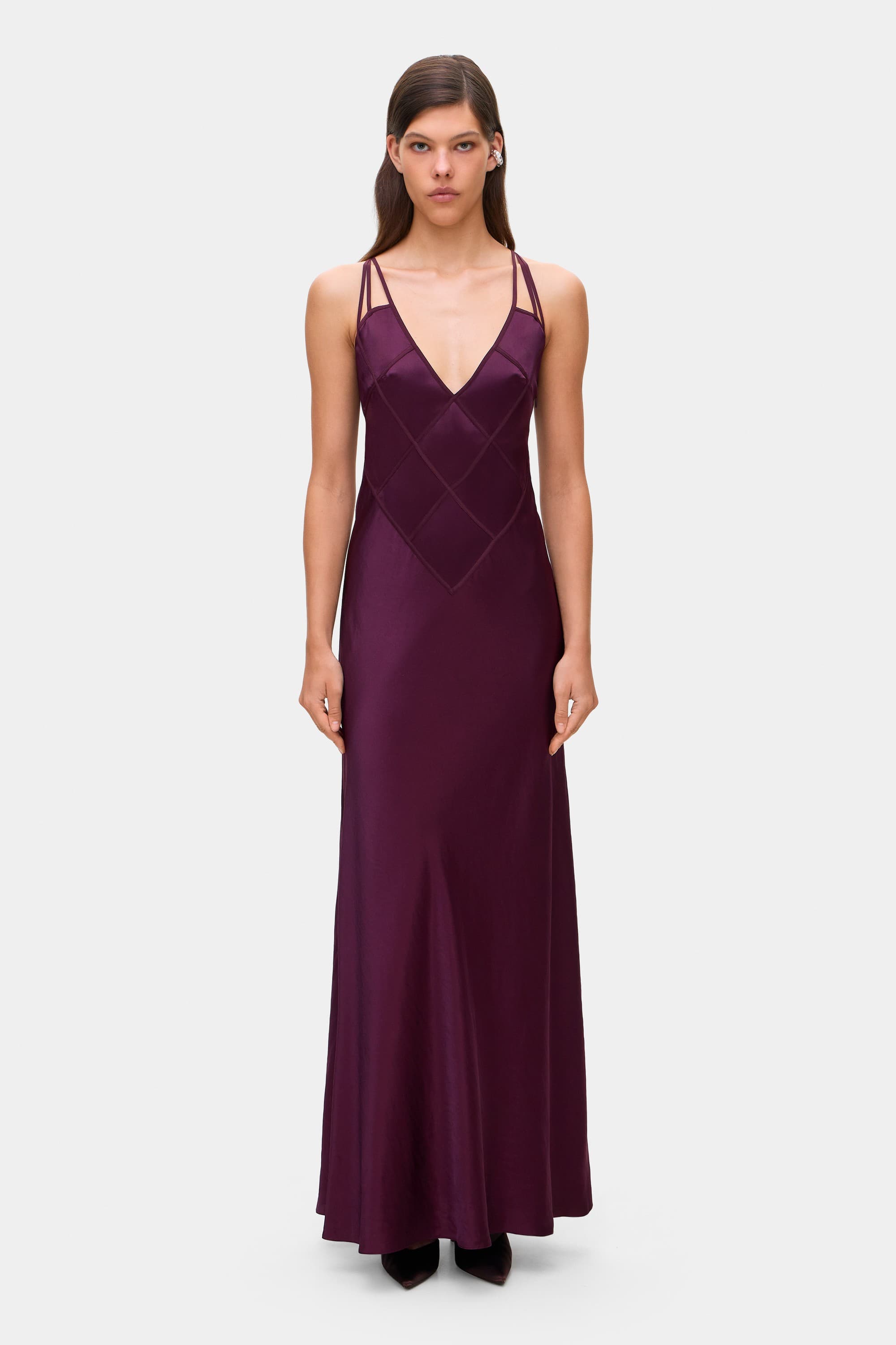Model in Melania maxi dress with decorative lines on the bodice front view