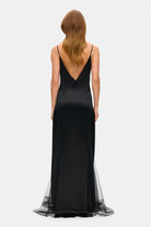 Model in fitted maxi Adelina dress back view
