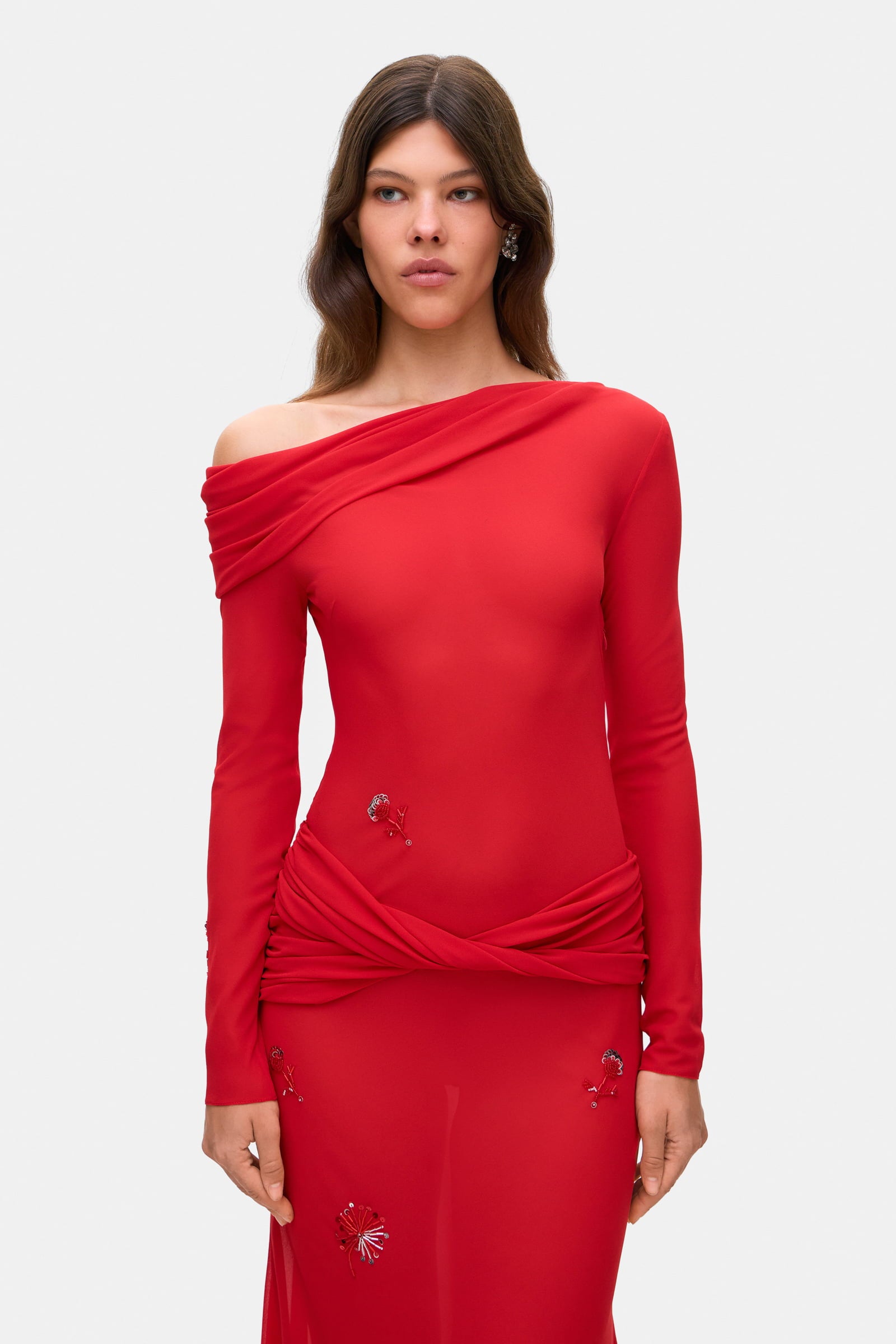 Model in Julie maxi dress with with decorative drapering and embroidery details front view