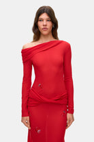 Model in Julie maxi dress with with decorative drapering and embroidery details front view