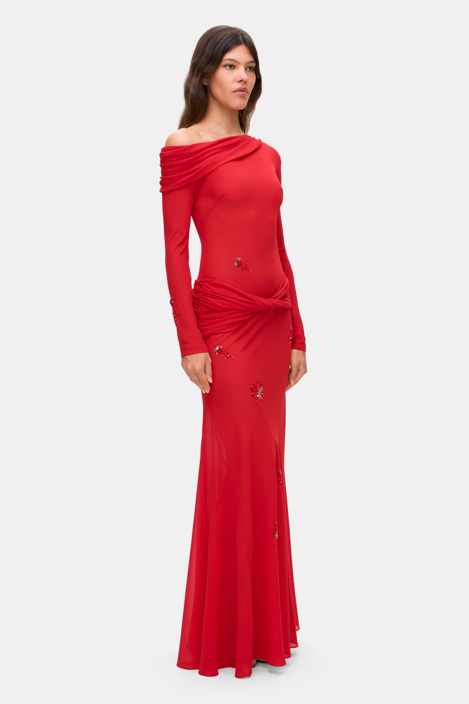 Model in Julie maxi dress with with decorative drapering and embroidery side view