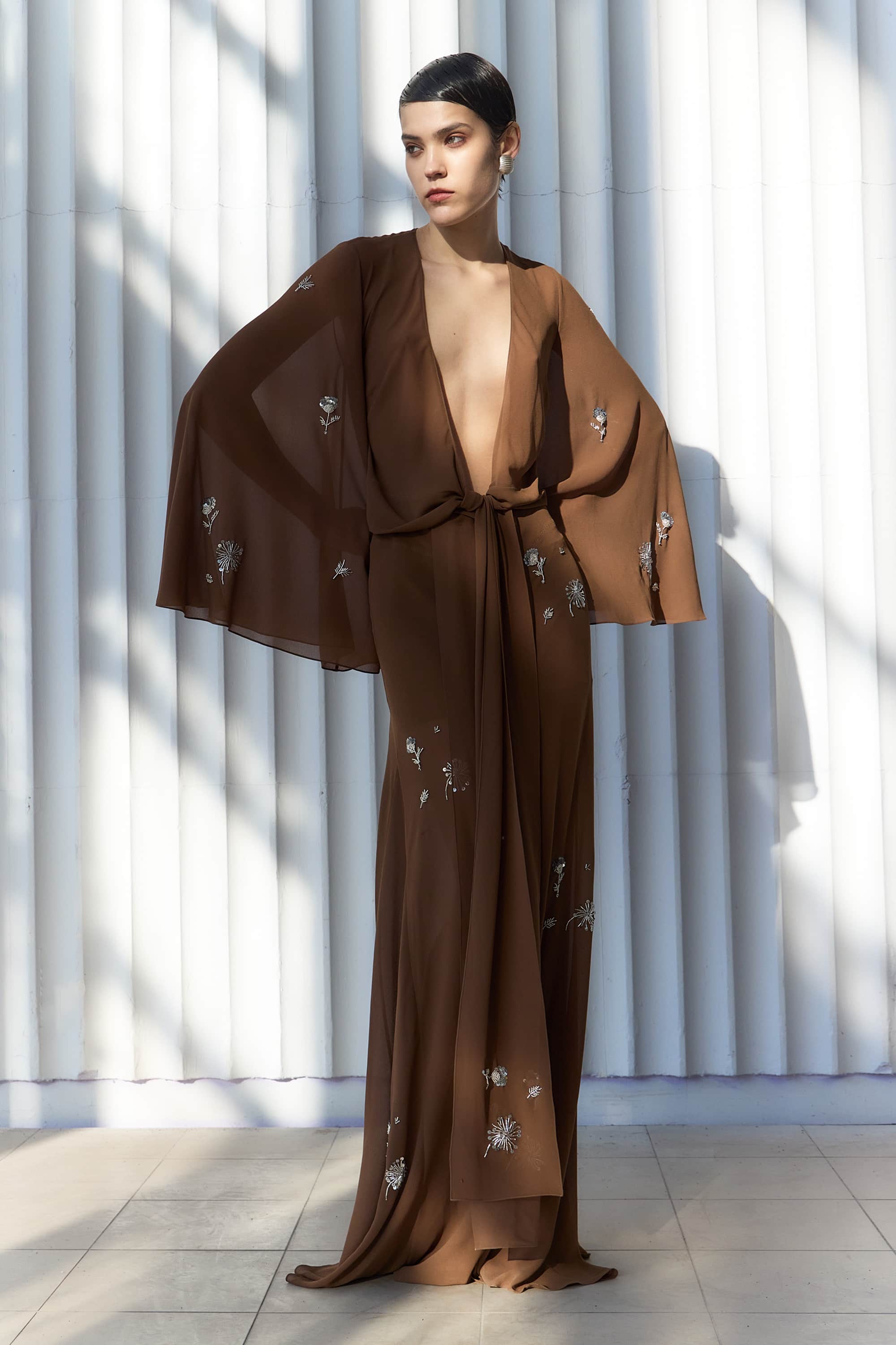 Model in wrap Marika blouse with embroidered sleeves front view