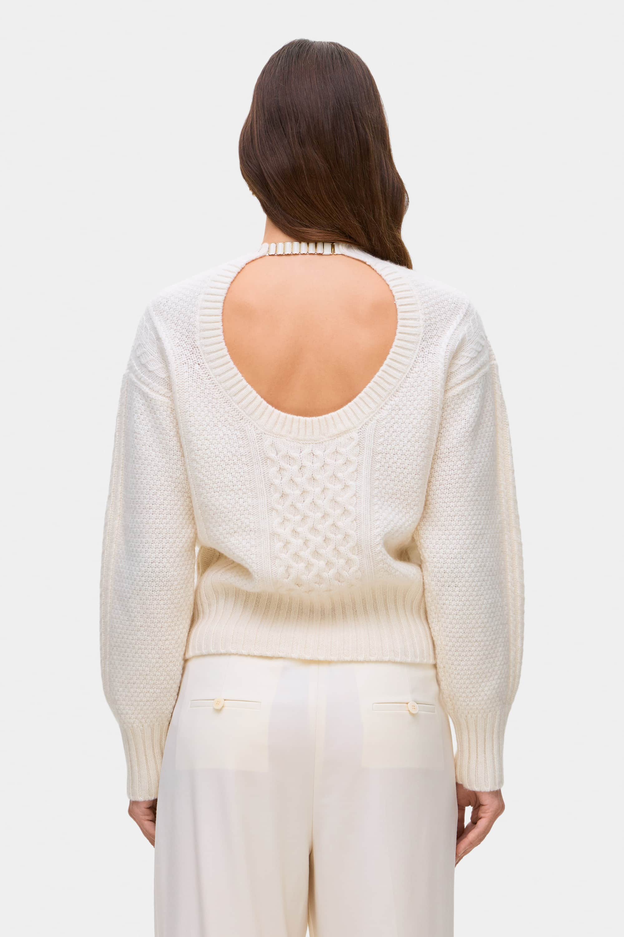 Model in cable knit Verona jumper back view