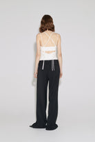 Model in black Noemie pants back view