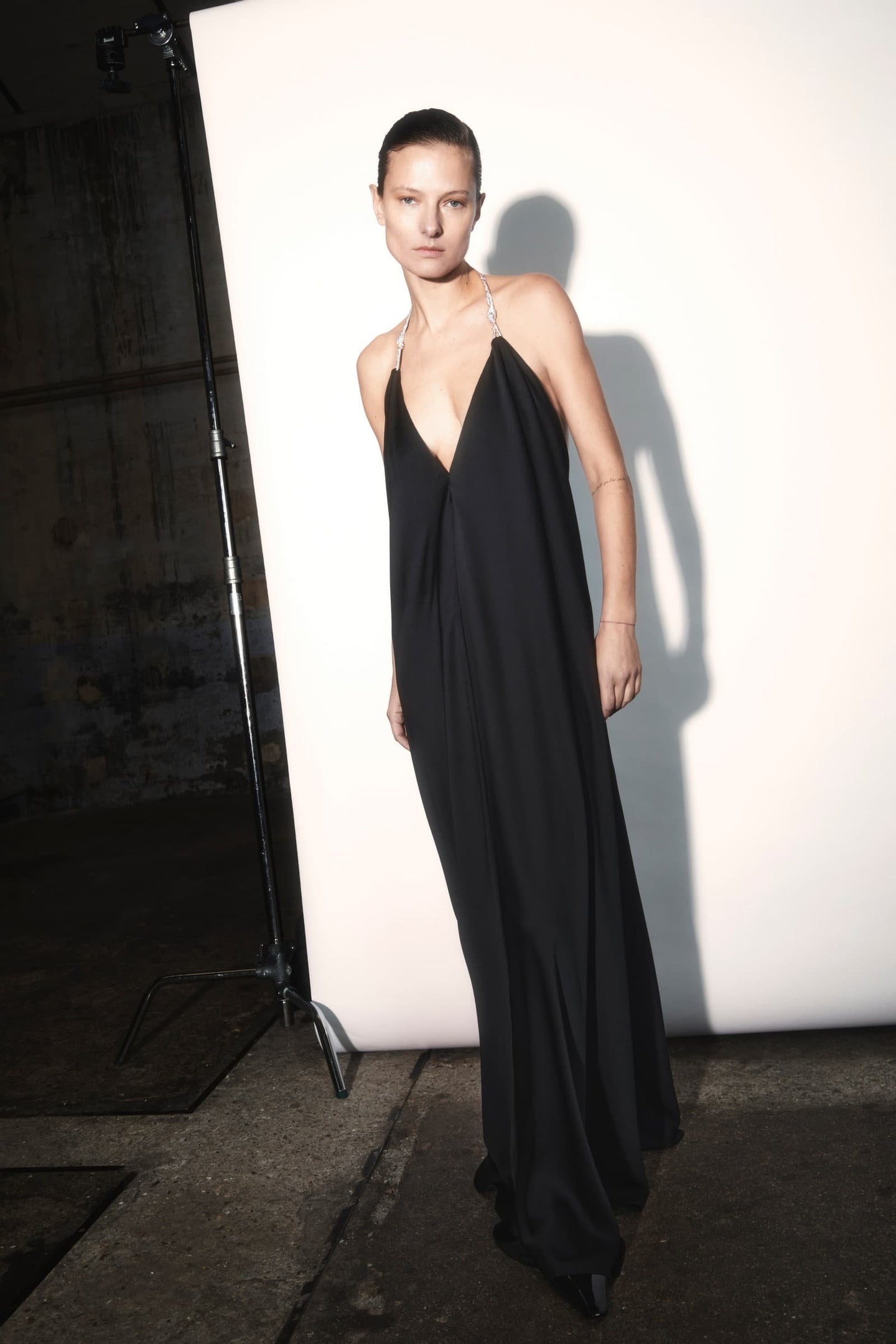 Model in black Charlize dress