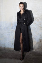 Model in black Hannah trench