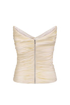 A strapless corset-style Lissa top in a buttermilk color, a central silver zipper, shown against a plain white background, back view