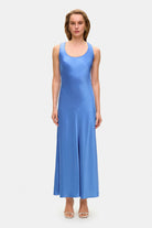 Model in midi fitted Lydia dress with a flared shape starting from the hips front view