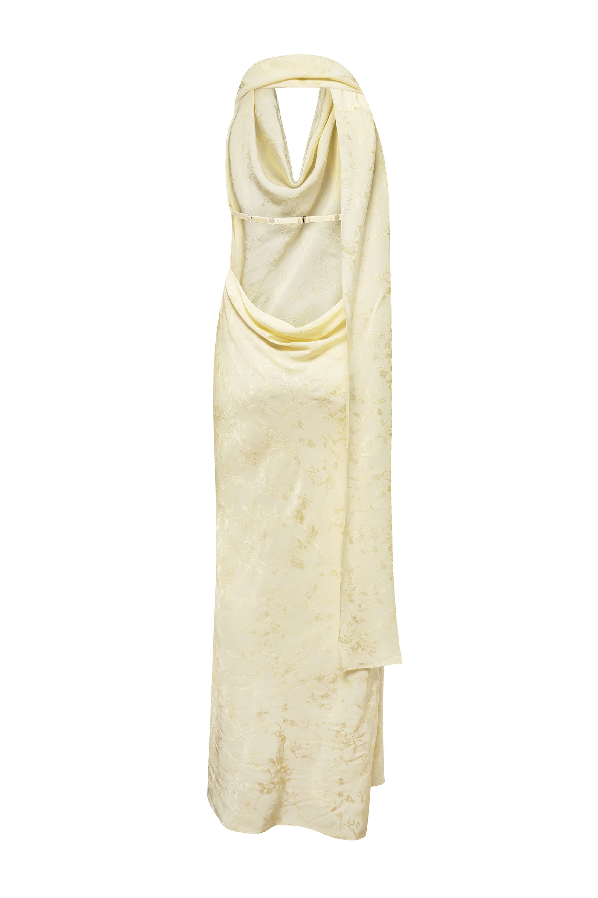 A pale yellow halter-neck maxi Kelly dress with a draped, cowl-like neckline and a subtle tonal textured pattern, shown against a plain white background, back view