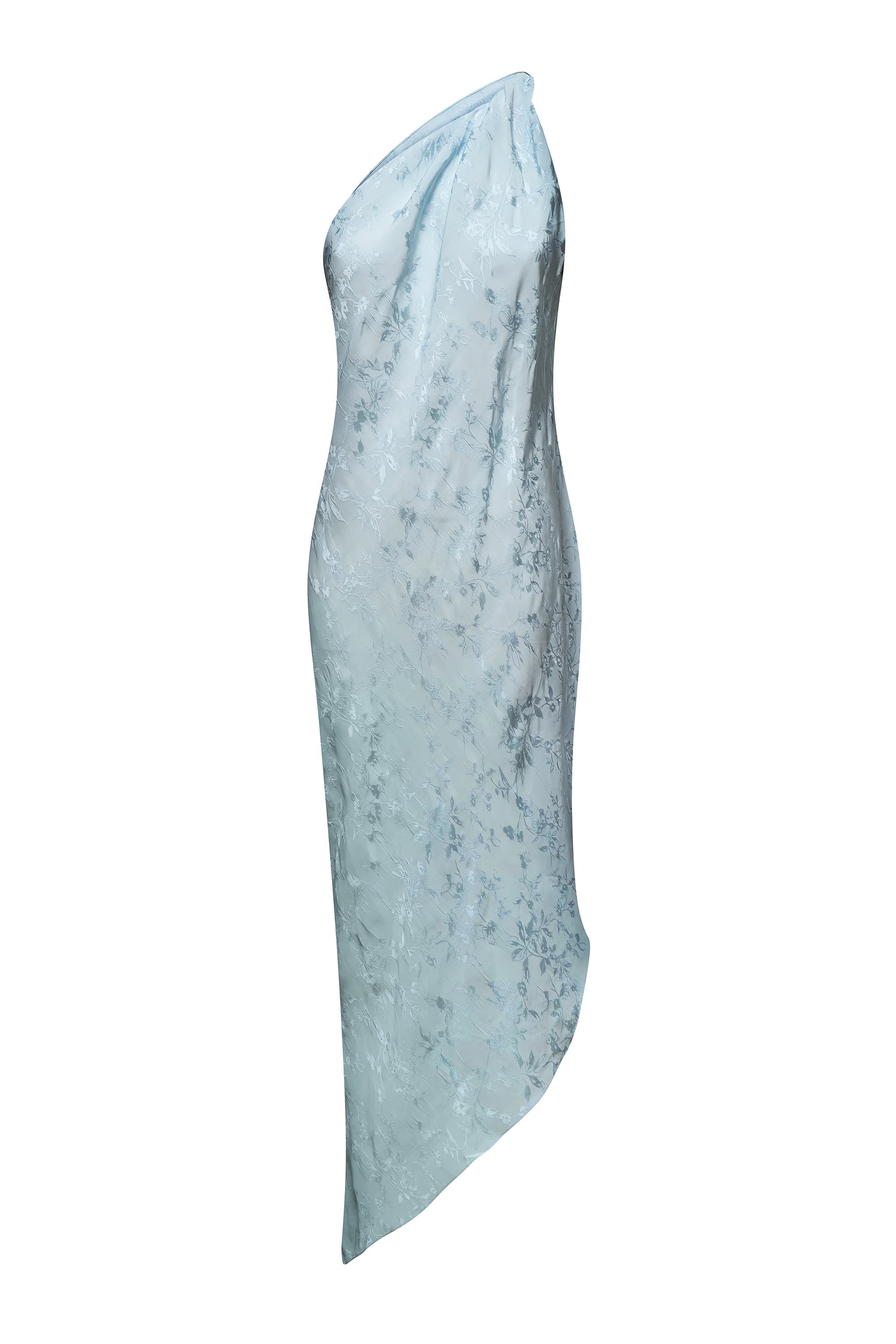 A light blue asymmetrical draped Rina dress with a textured subtle tonal floral pattern, shown against a plain white background, back view