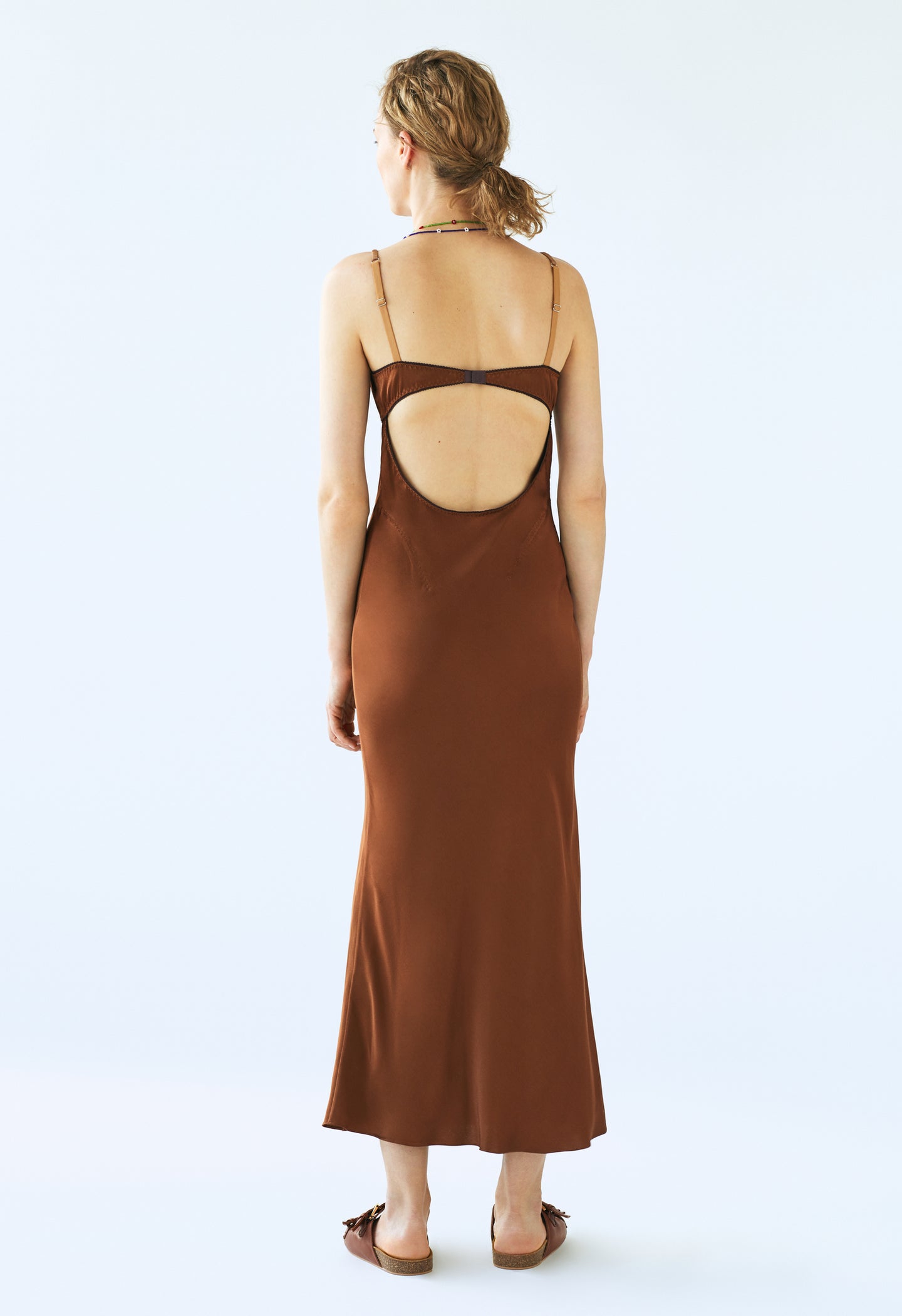 Model in brown Waterlily dress back view