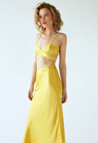 Model in yellow Voleta skirt