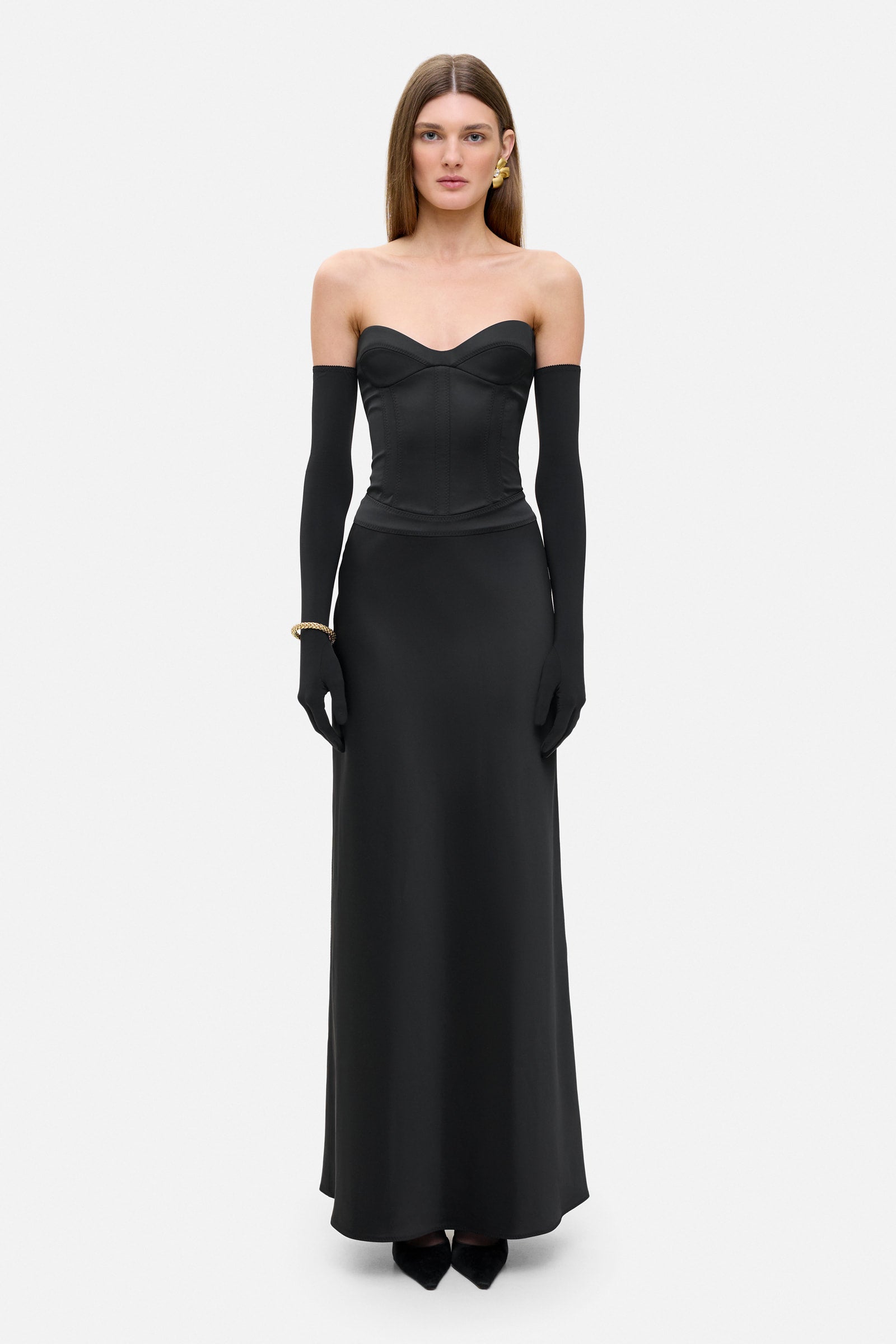 Model in silhouette Delancy maxi dress with a corset bodice front view