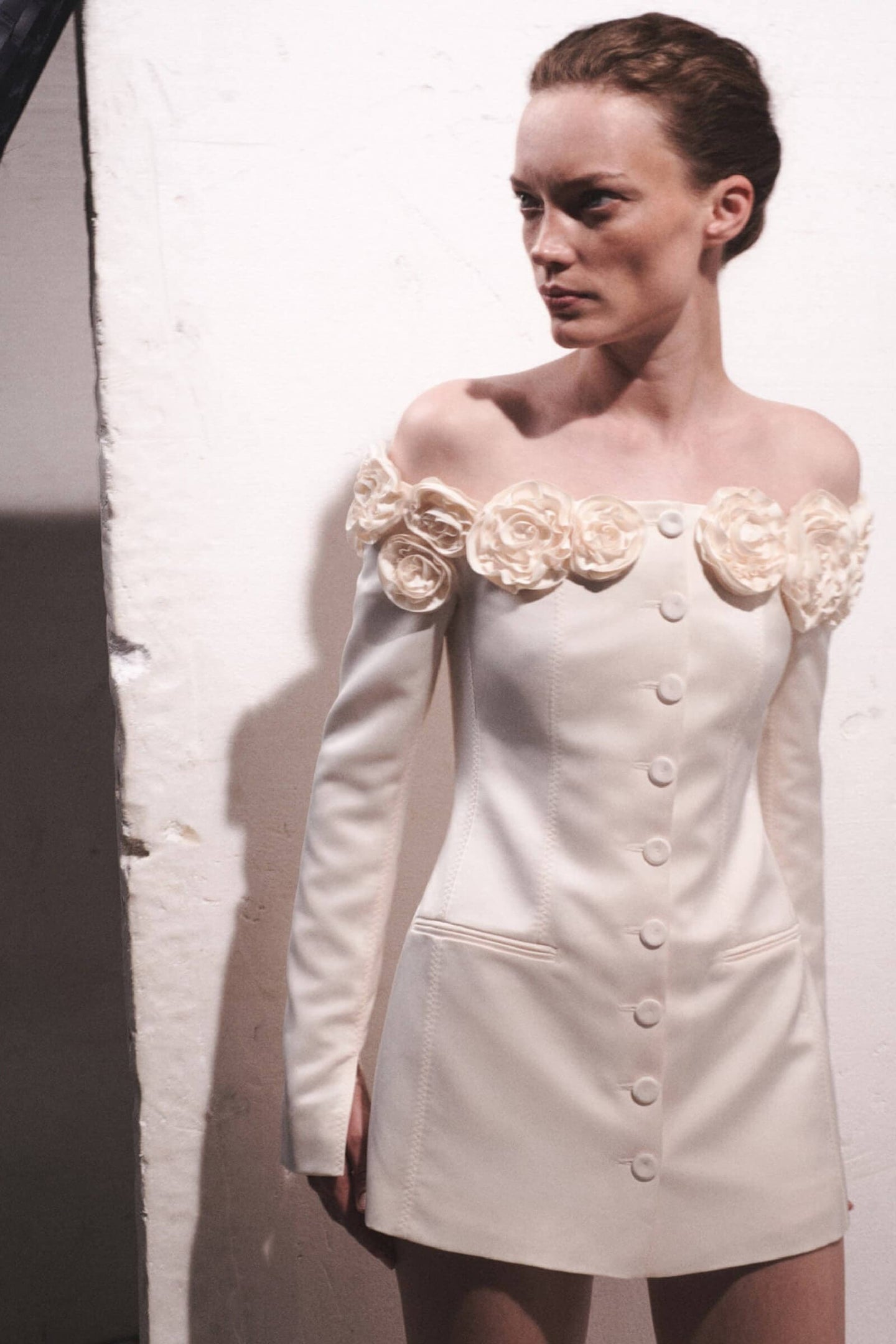 Model in ivory Micaela dress