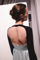 Model in black Amy bolero back view