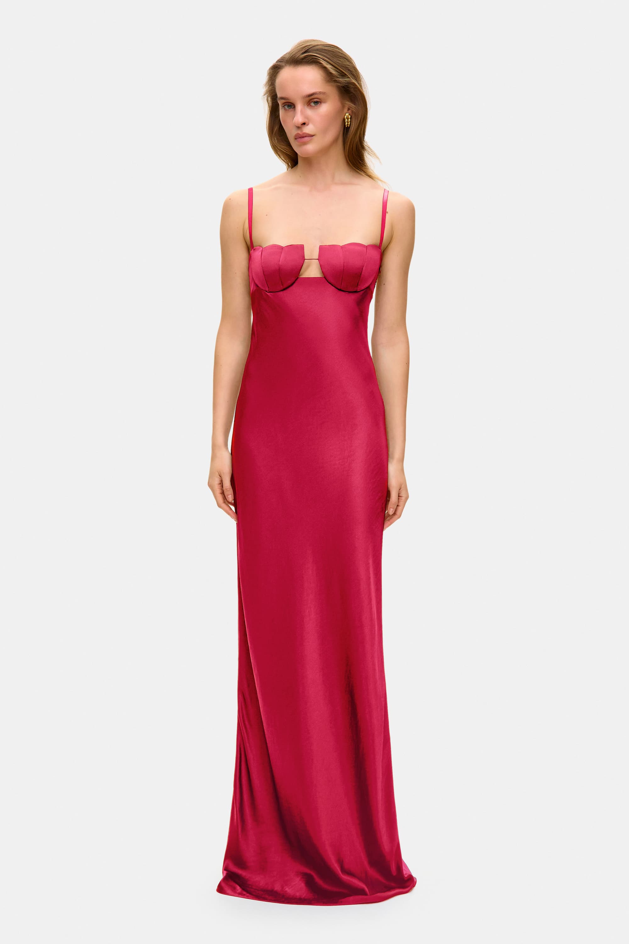 Woman wearing a berry Tulip dress with a textured bodice against a white background, front view