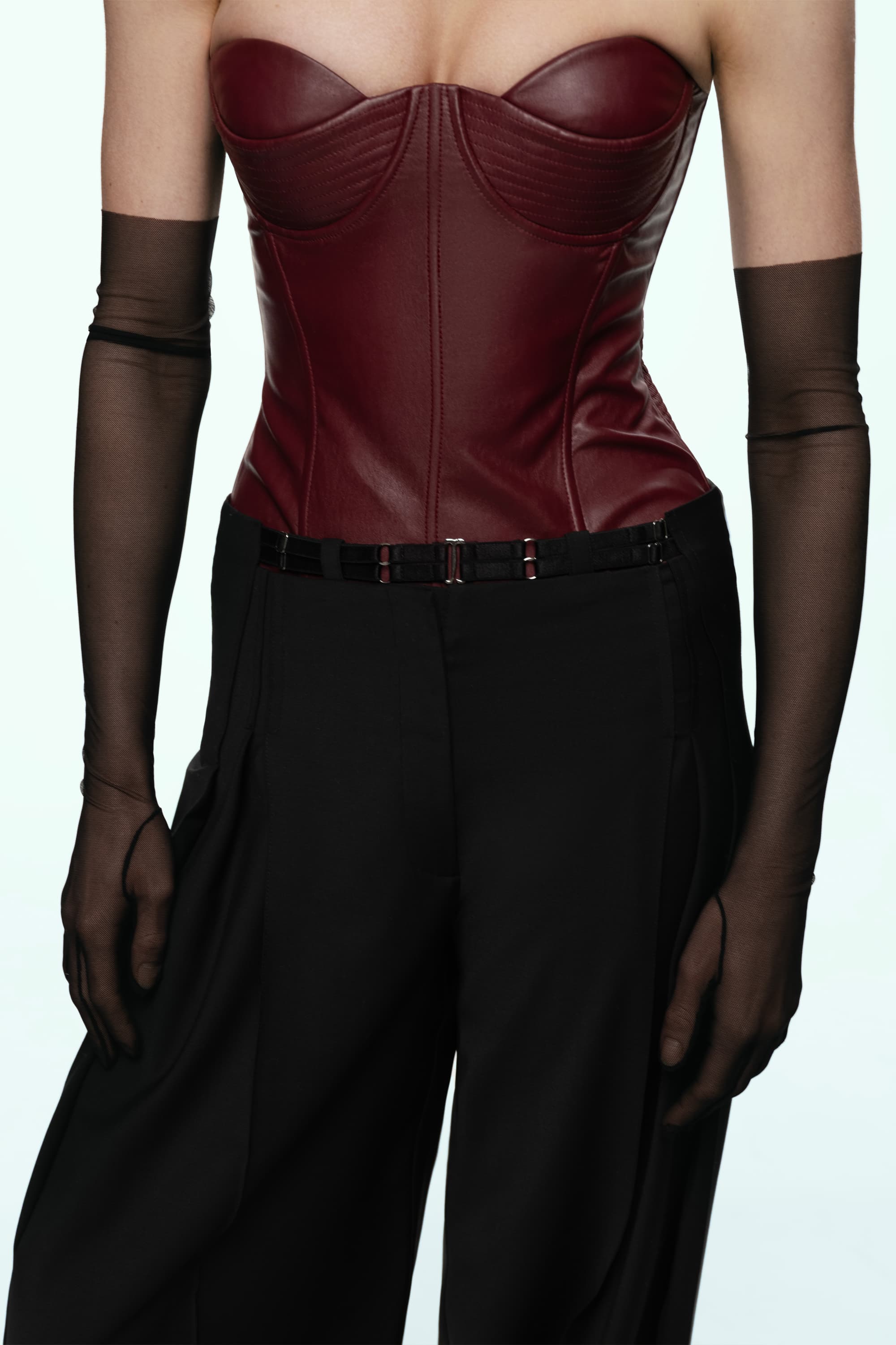 Woman wearing a black wide-leg Katherine pants on a white background, front view