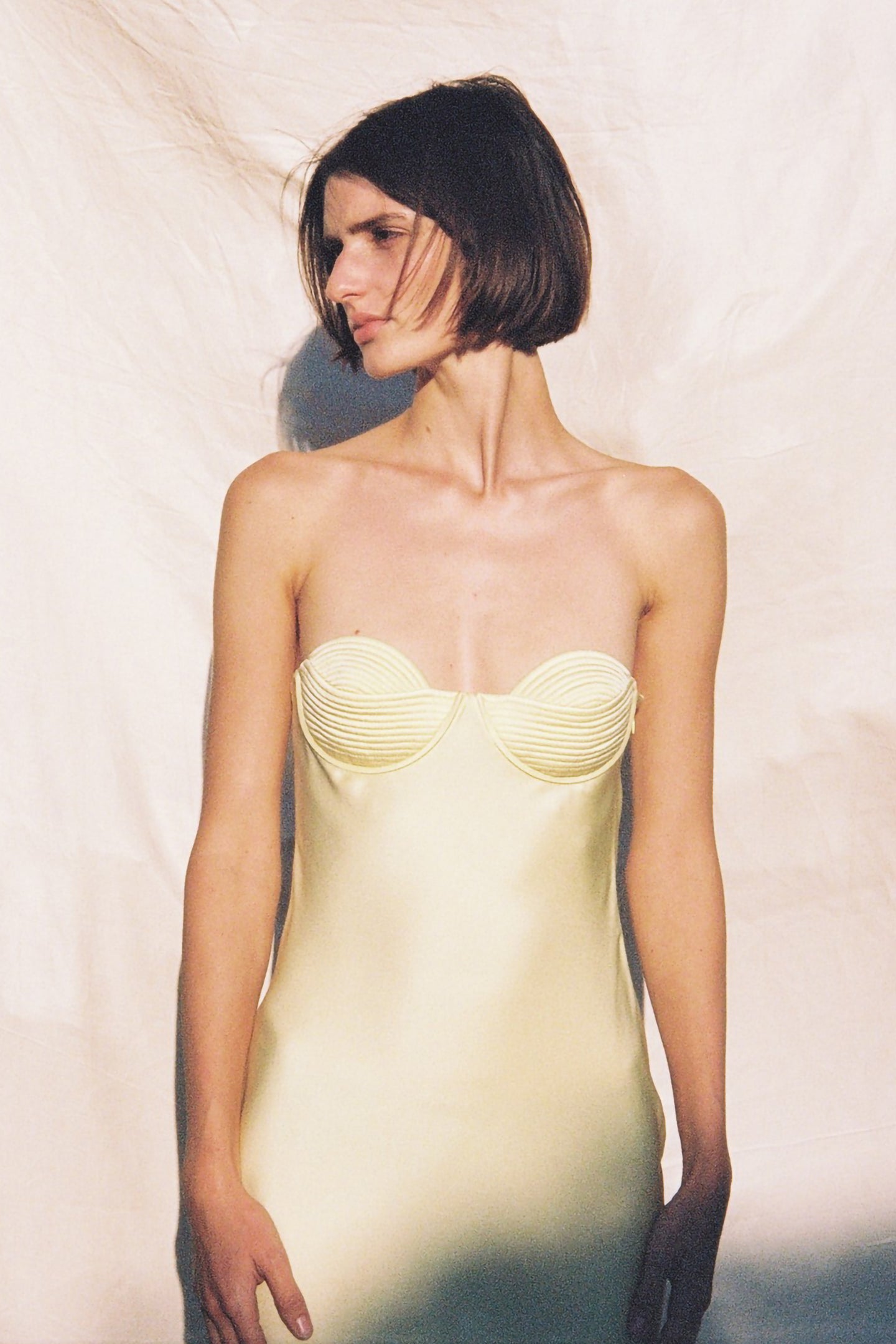 Model in yellow Levi dress front view