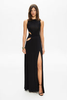 Model in knitted maxi silhouette Abelia dress with cuts on waist front view