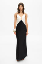 Model in maxi contrast Terrin dress on straps with a cut on the bodice front view